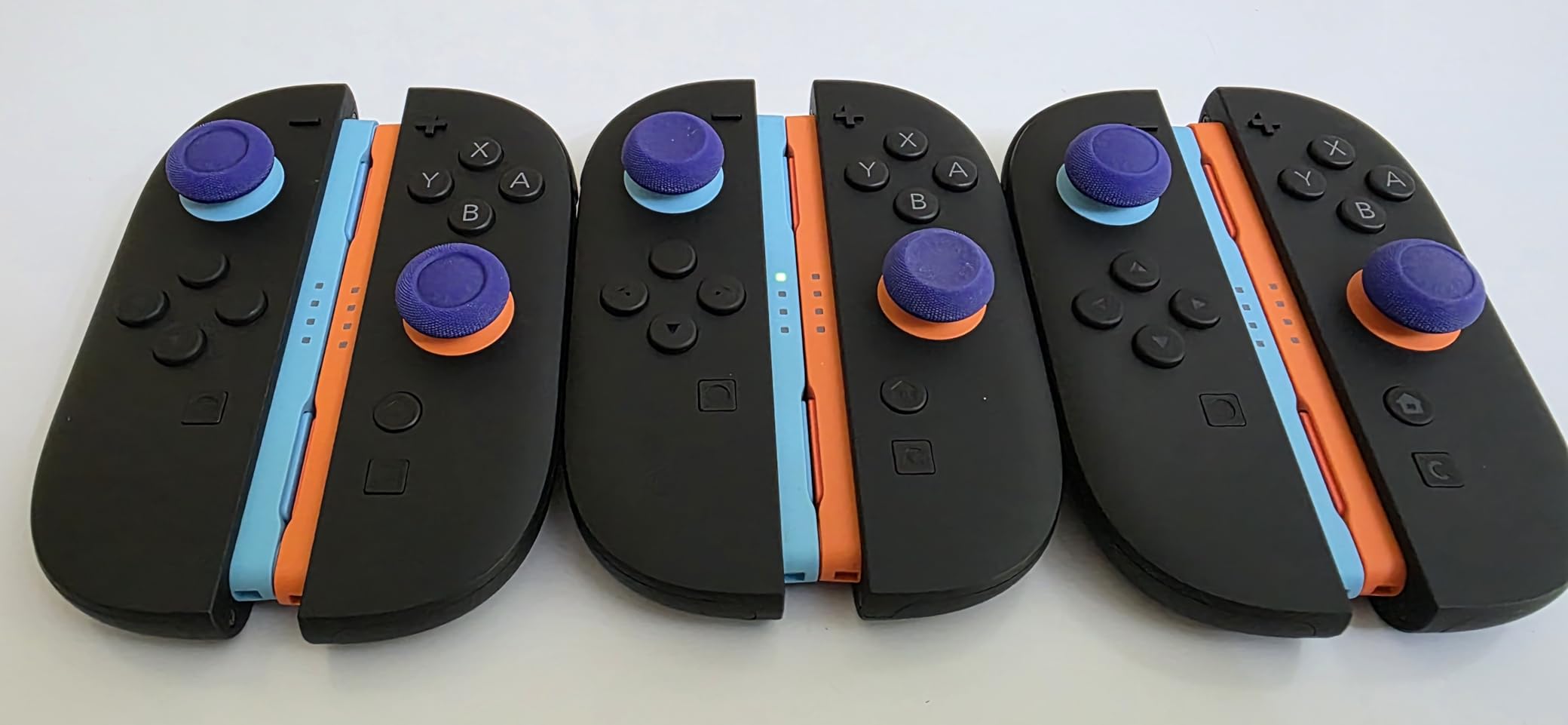 by Skull & Co.Thumb Grips Joystick Cap Analog Stick Cover for Nintendo Switch 2 Joy-Con - Neon Blue & Red, 3 Pairs (6pcs) customer photo 2