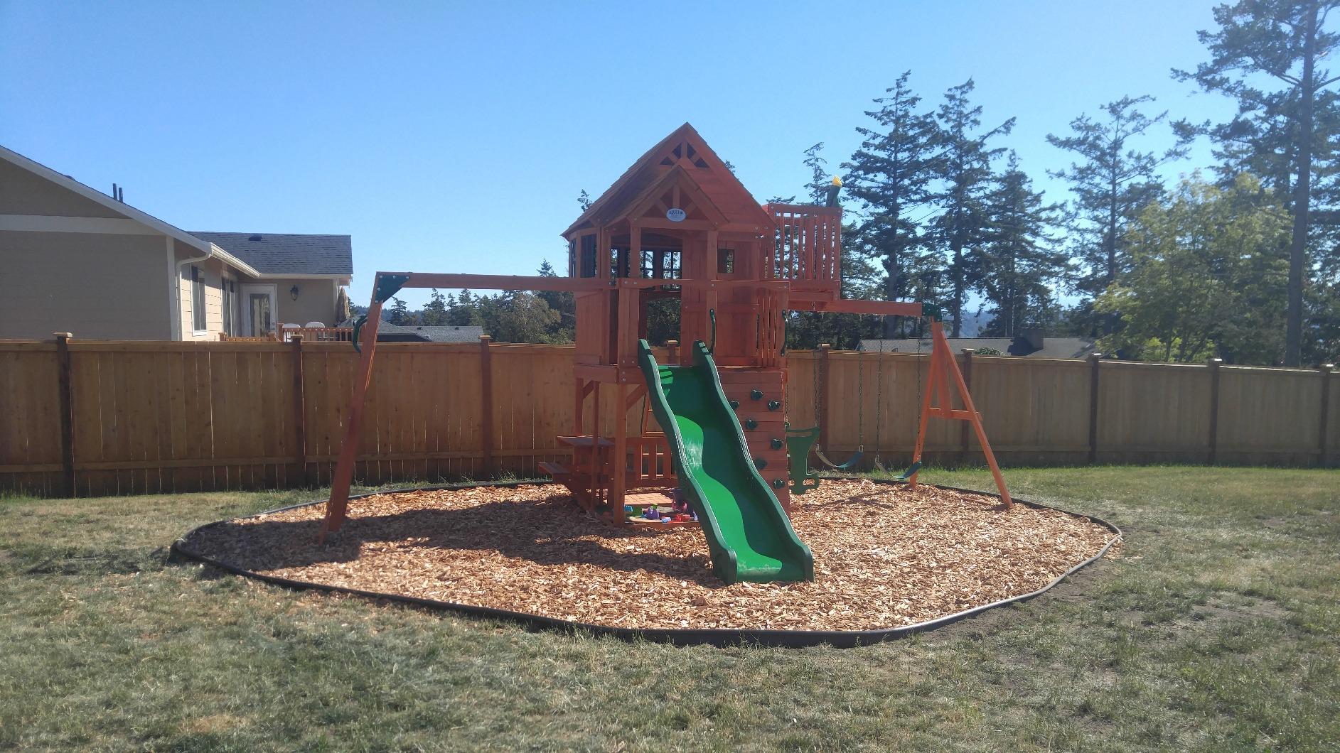 Backyard Discovery Skyfort II Cedar Wood Swing Set with Wave Slide, Raised Clubhouse, Crow's Nest, Monkey Bars, Balcony, Belt Swings, Trapeze, Rock Wall, Picnic Table, Sandbox, Ladder, Outdoor Playset customer photo 1