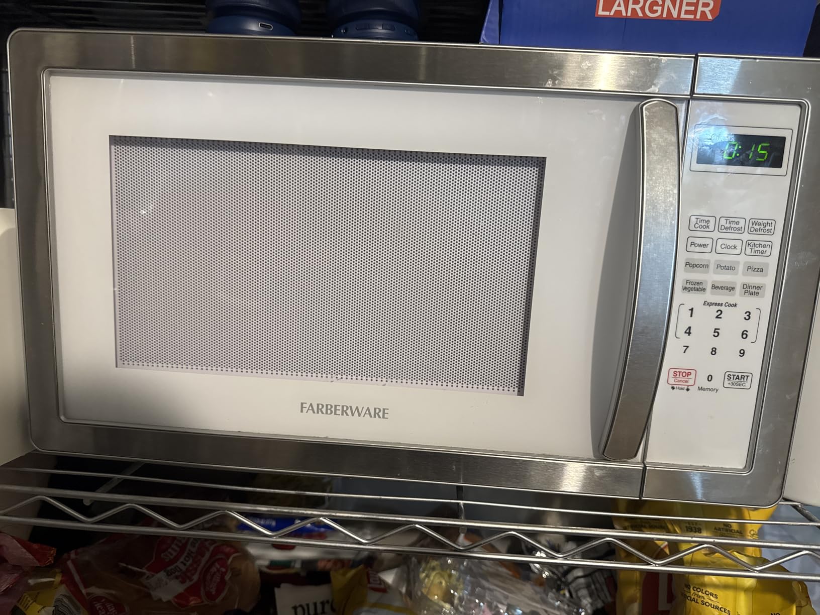 Farberware 0.7 Cu. Ft. Countertop Microwave Oven - 700 Watts Power, Auto Cook Settings, Defrost, Easy Clean and Child Safety Lock - Stainless customer photo 1