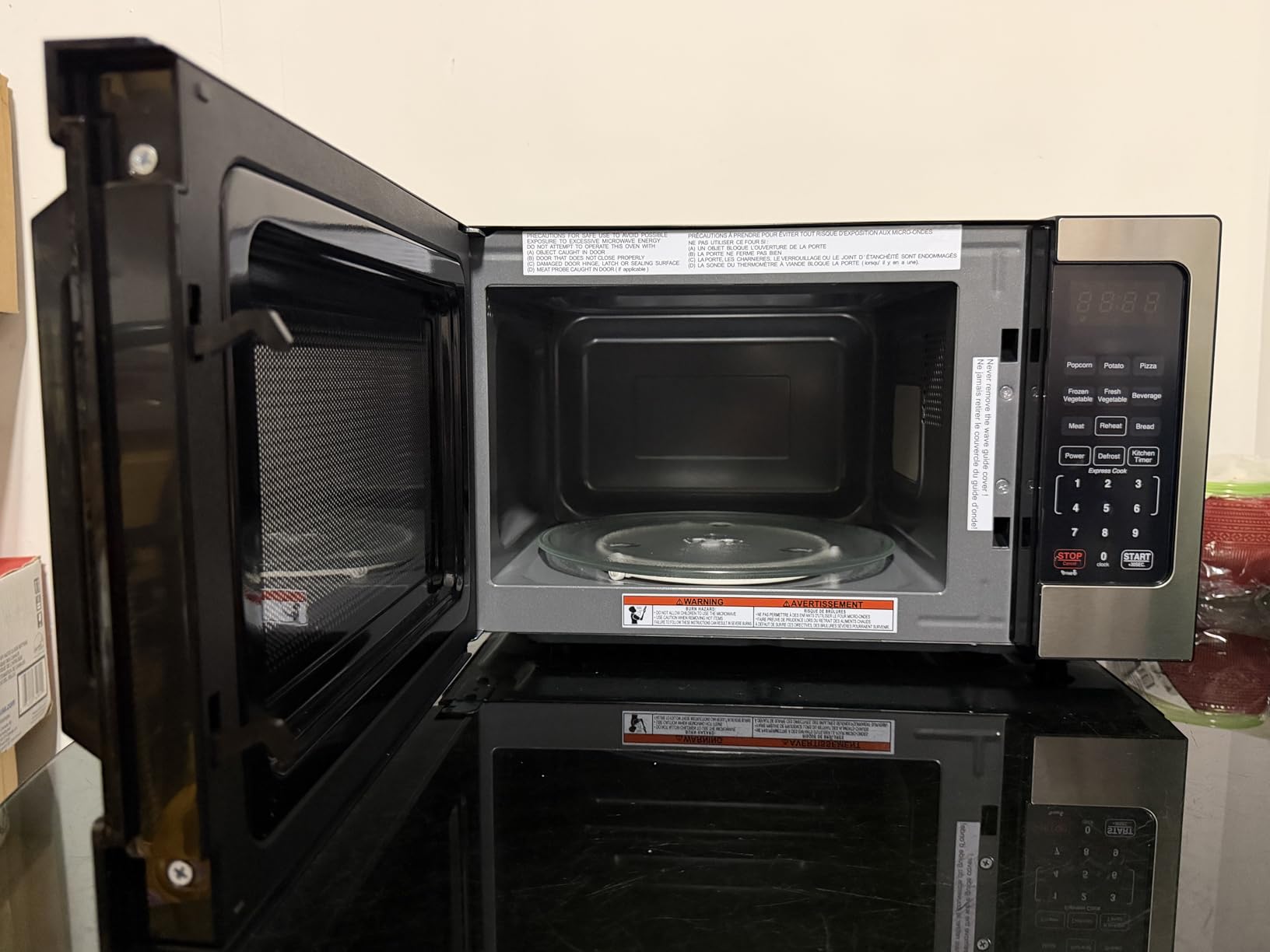 Farberware 0.7 Cu. Ft. Countertop Microwave Oven - 700 Watts Power, Auto Cook Settings, Defrost, Easy Clean and Child Safety Lock - Stainless customer photo 2
