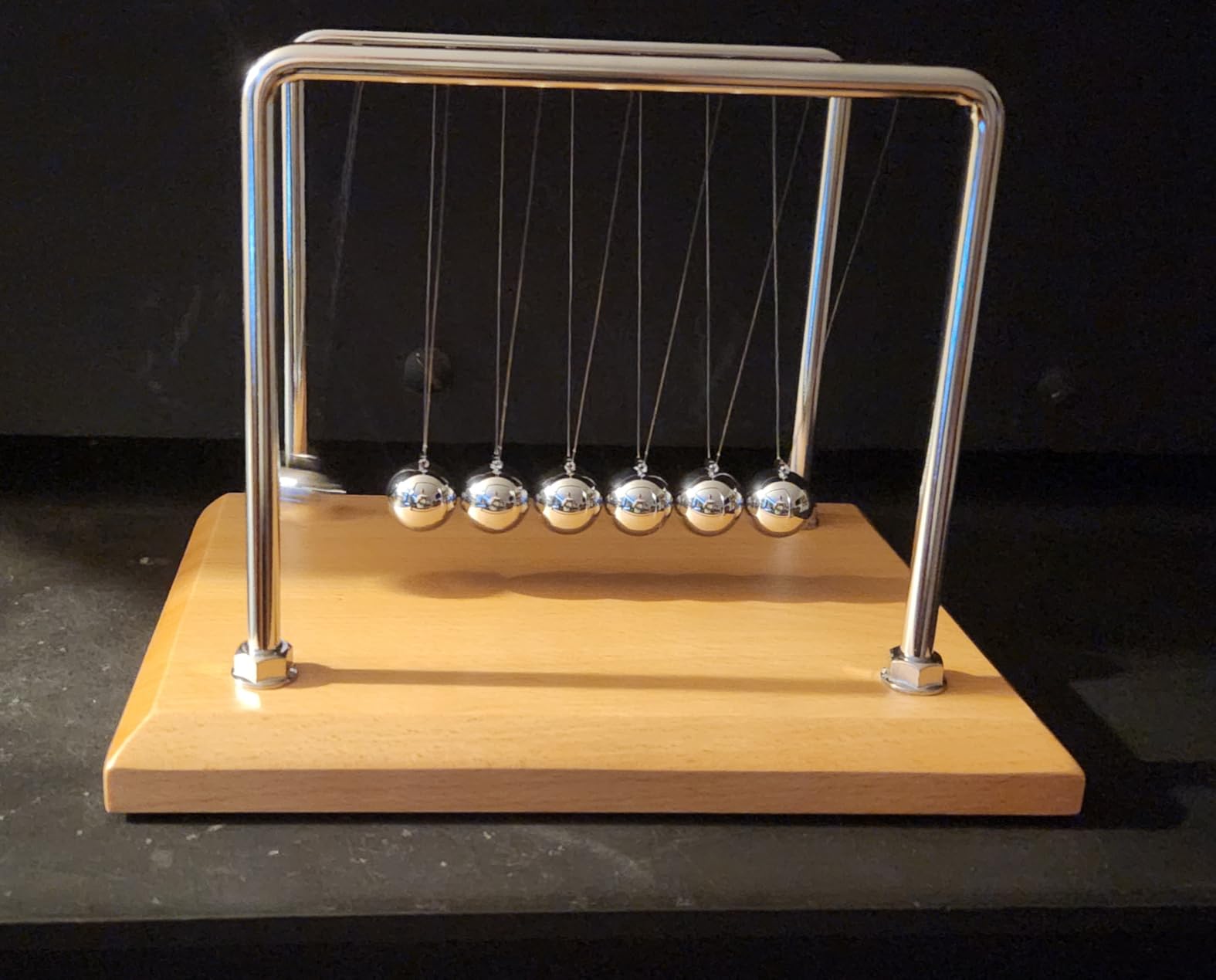 CERROPI Large Newtons Cradle Pendulum with 7 Balls, Physics Perpetual Motion Desk Toys for Office, Calm Down Fidgets, 50+ Sec Swingtime (Beech Base) customer photo 1