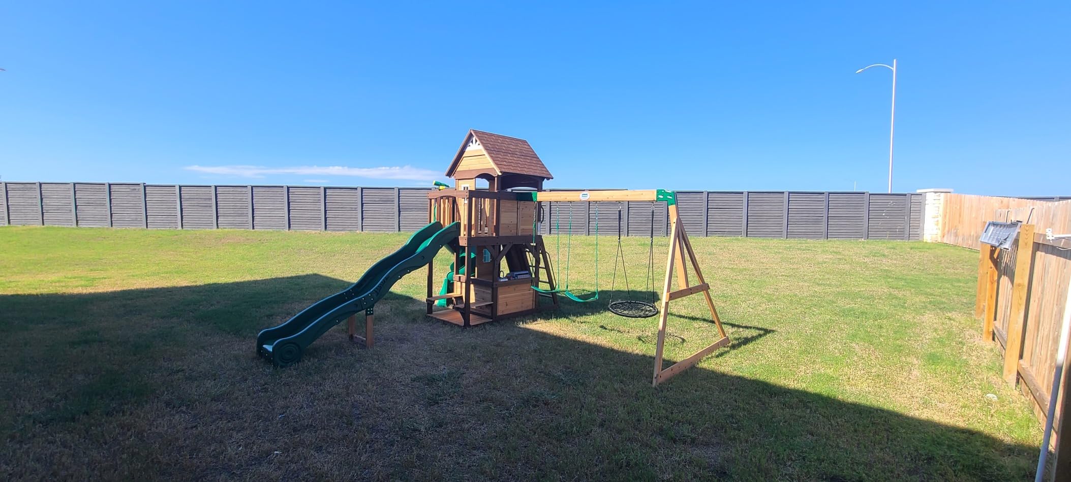 Backyard Discovery Cedar Cove Wood Swing Set with Spiral Tube and Wave Slide, Clubhouse, Toy Grill, Snack Bar, Rock Wall, Belt Swings, Web Swing, Balcony, Chalkboard, Ladder, Outdoor Playset 10 Years customer photo 2
