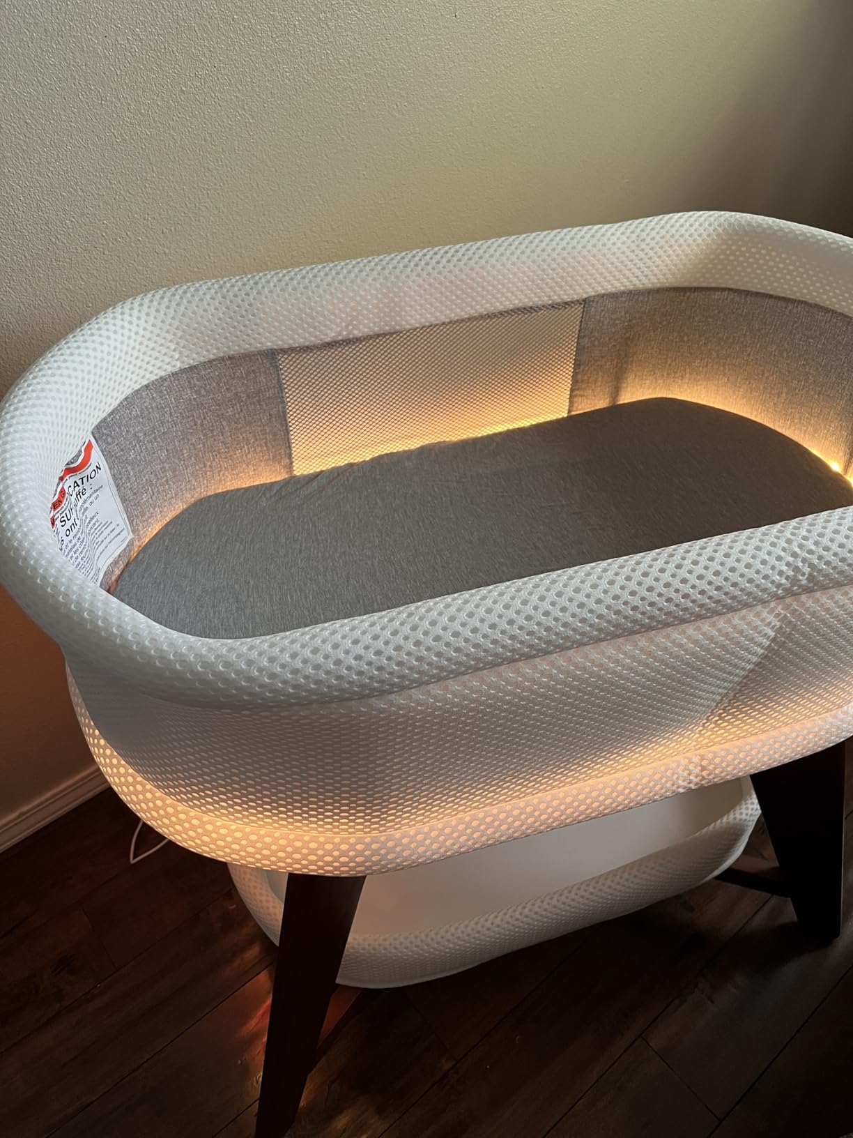 TruBliss Evi Smart Baby Bassinet Beside Sleeper with Auto-Glide, Ambient Nightlight & Sensory Sounds, Compatible with Alexa and Google Home, Includes 2 Sheets (Soft White w/Espresso Legs) customer photo 2