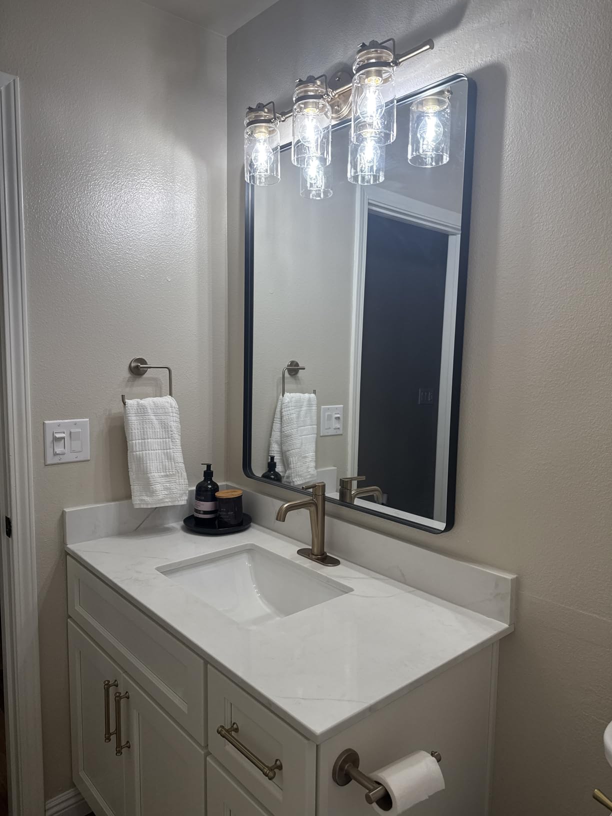 Kichler Brinley 4-Light Bathroom Vanity Light Fixture with Clear Glass in Champagne Bronze, Industrial Farmhouse Style for Mirror Lighting (32.5