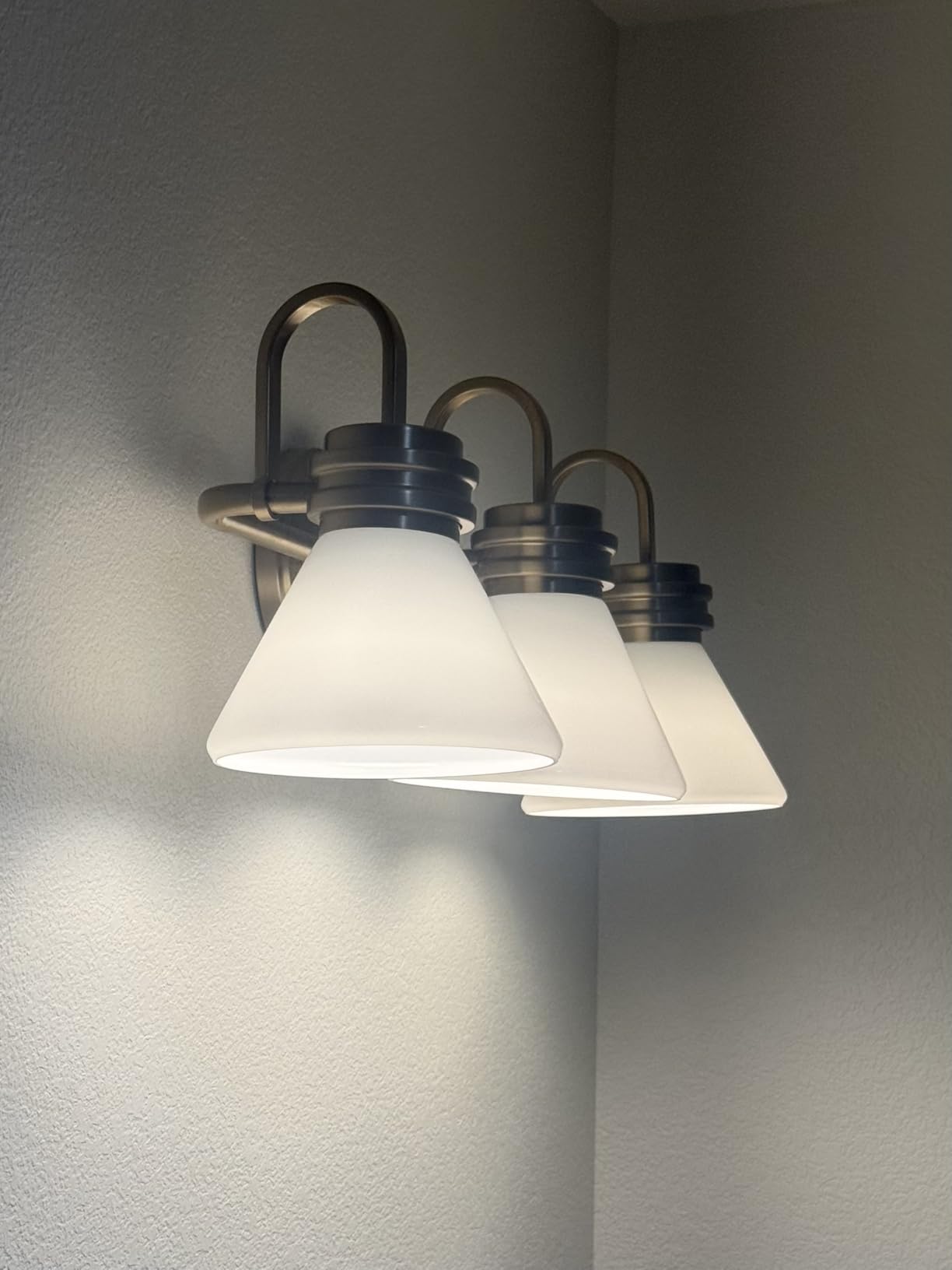 Kichler Farum 2-Light Bathroom Vanity Light Fixture with Opal Glass Shades in Champagne Bronze, Modern Wall Mount Over Mirror for Powder Room (19.25