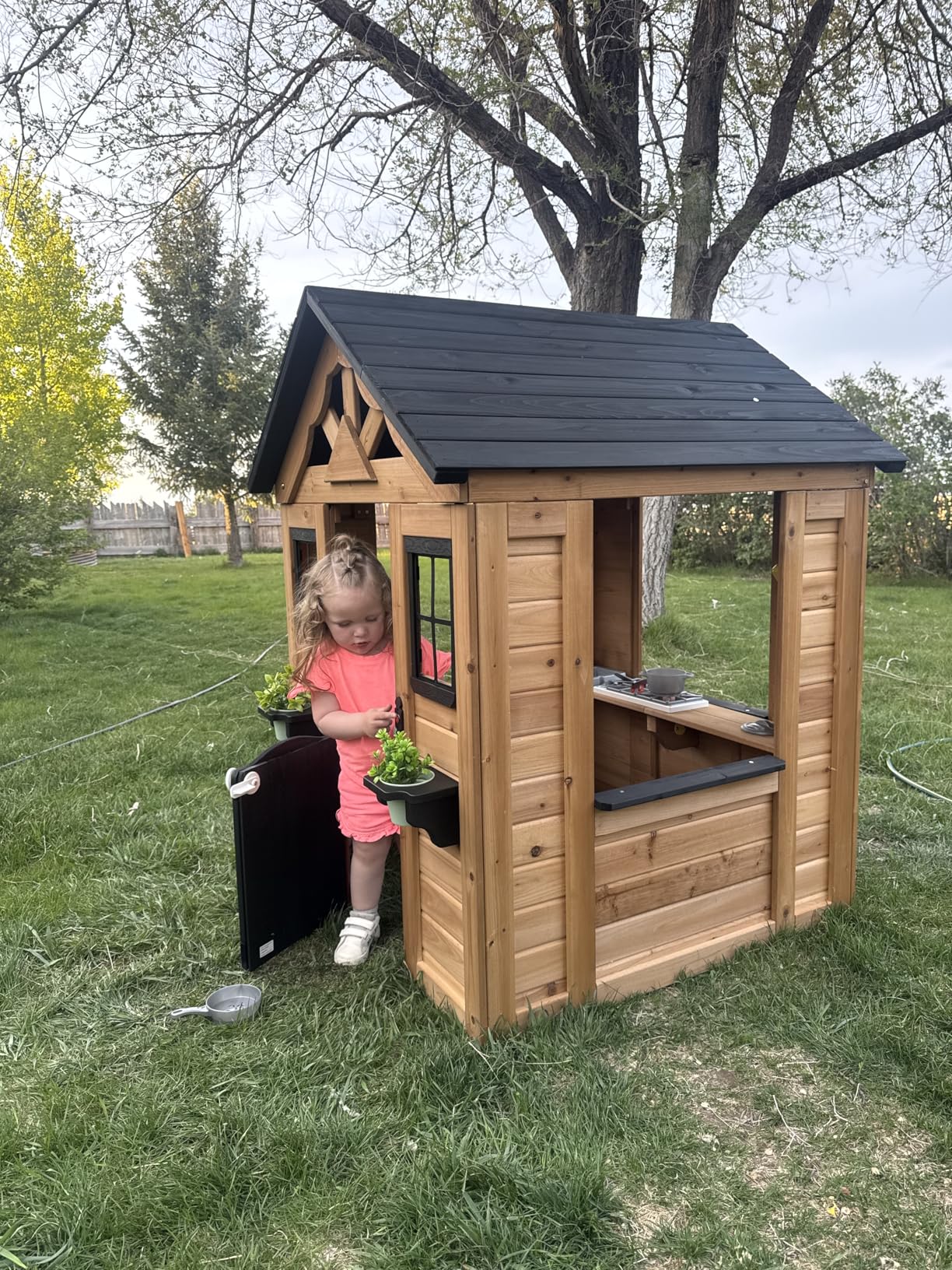 Backyard Discovery Sweetwater Cedar Wooden Kids Playhouse Cottage with Play Kitchen, Snack Bar, Half Door, Toy Phone, Windows, Flowerpot Holders, and Working Doorbell for Outdoor Imaginative Play customer photo 1