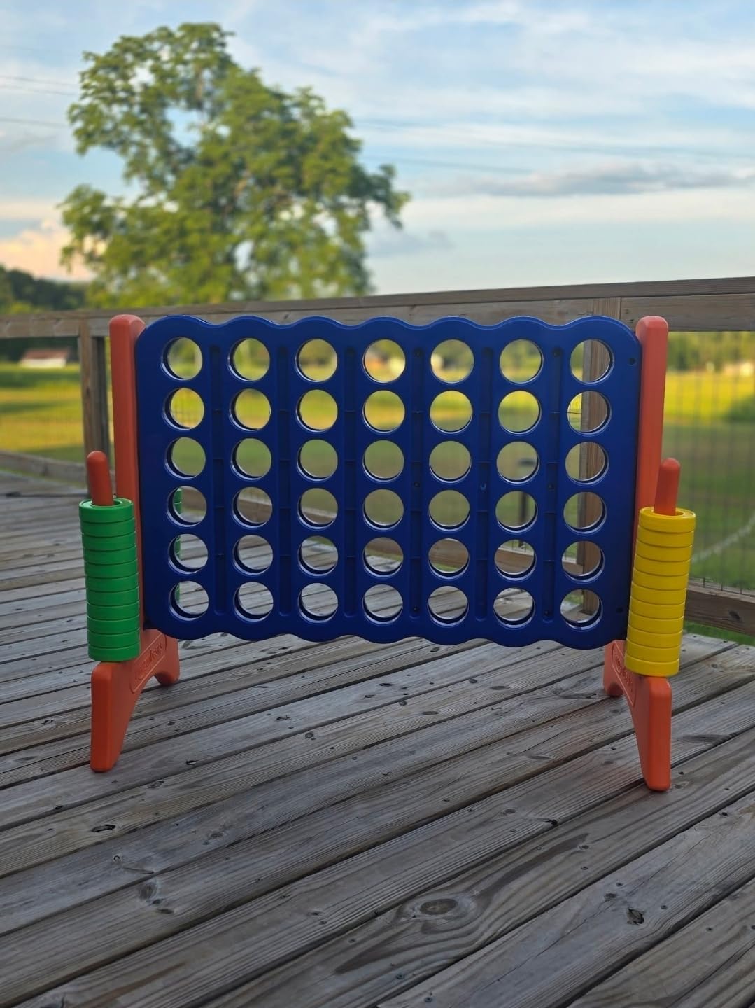 Amazon Basics Junior 4-to-Score Giant Premium Plastic Party Game for Kids & Adults, Indoor & Outdoor, BPA-Free with Carrying Bag, Blue, Yellow, Red, Green, Large customer photo 1