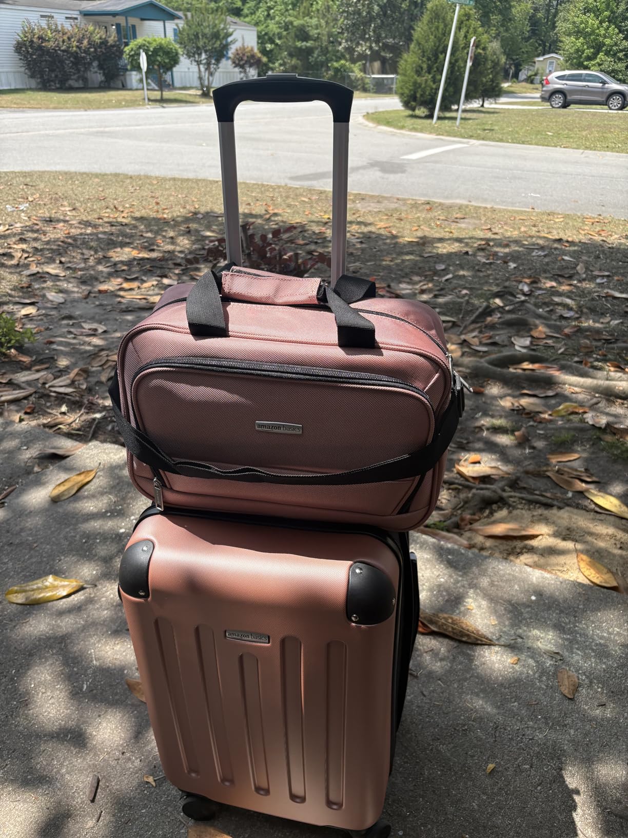 Amazon Basics 4-Piece Luggage Set, Hardside Spinner Suitcases with Multidirectional Wheels (22 Carry-On and 28 Checked), Plus 15-inch Tote Bag and 10-inch Compact Travel Bag, Rose Gold customer photo 1