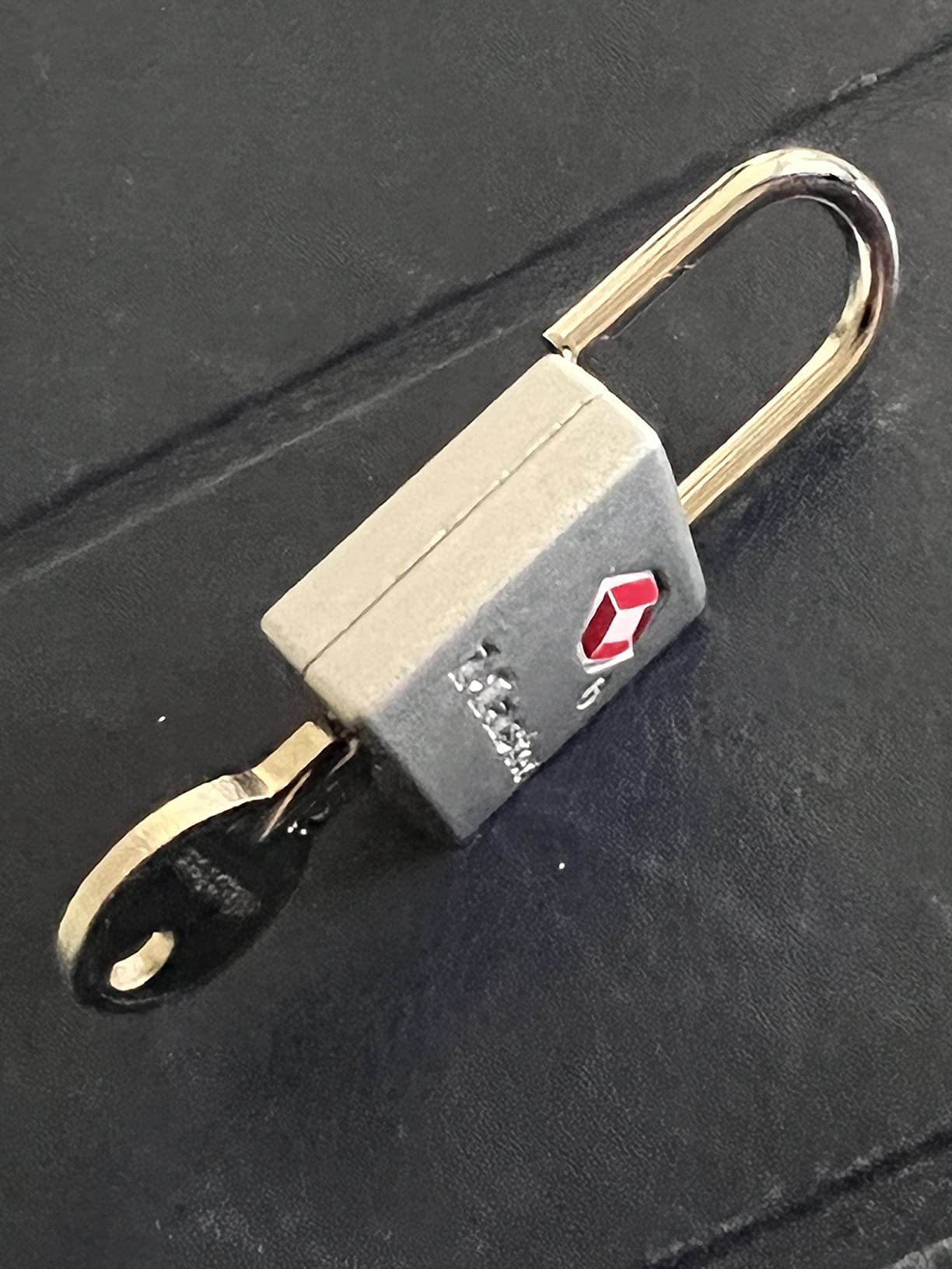 Master Lock TSA Luggage Lock Keyed Alike, Brass and Nickel, 4-Pack 4683Q | TSA Accepted Luggage Lock For Suitcases, Backpacks, Travel Bags, Airport Security, Brass, 7/8-inch Long Steel Shackle customer photo 1