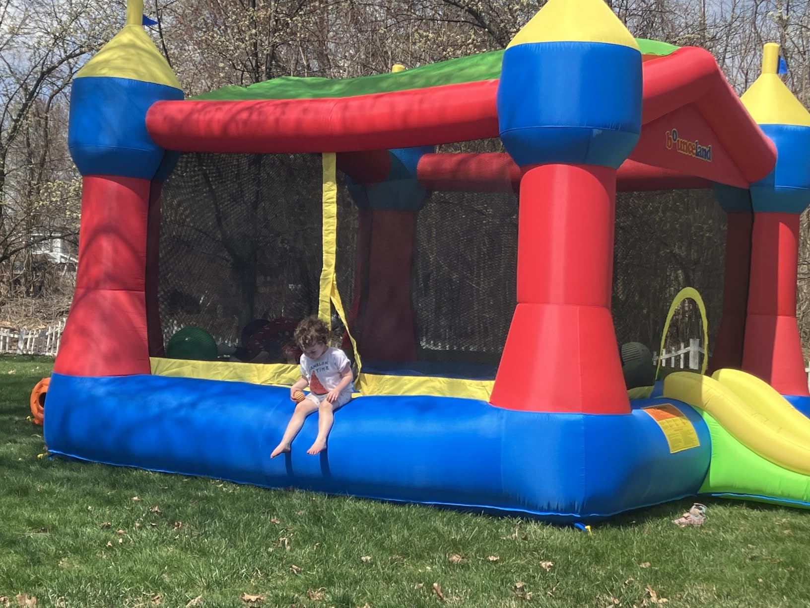Bounceland Inflatable Party Castle Bounce House Bouncer, 16 ft L x 13 ft W x 10.3 ft H, Basketball Hoop, Removable Sun Roof, UL Strong Blower included, Fun Slide and Bounce Area, Castle Theme for Kids customer photo 1