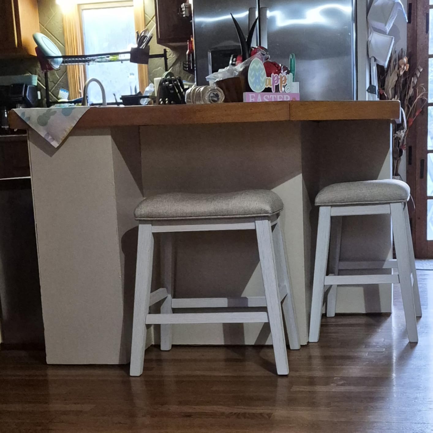 Signature Design by Ashley Skempton Counter Height Bar Stool, Set of 2 | Space-saving 24-inch farmhouse design, Supportive 18.5-inch foam-cushioned saddle seat, Distressed wood frame with footrest customer photo 1