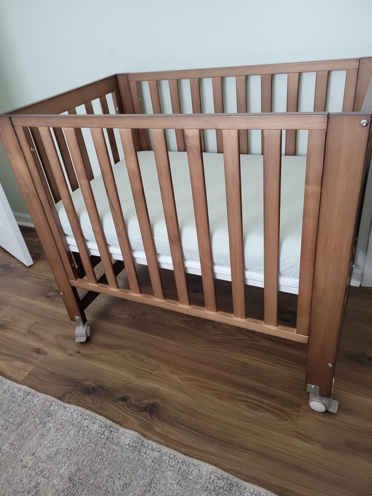 MAMAZING EvoNest 6-in-1 Convertible Baby Mini Crib with Wheels | GREENGUARD Gold Certified, New Zealand Pine Wood, 4 Adjustable Heights, Rocking Mode, Small Spaces Design, Washed Natural customer photo 2