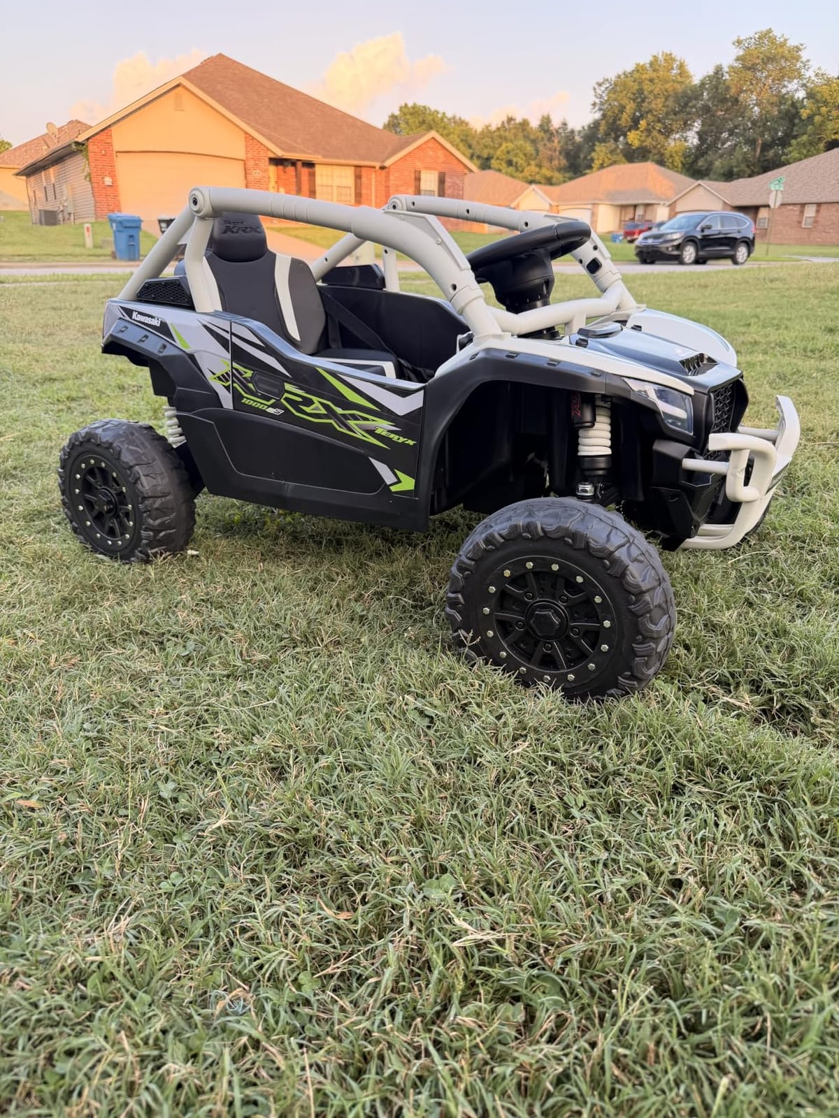 24V Licensed Kawasaki Teryx KRX UTV with Remote Control for Kids | 4WD Ride On Toy with Three-point Seatbelt, 1 Seater, EVA Tires, Headlight, Music Player, Spring Suspension, Black customer photo 1